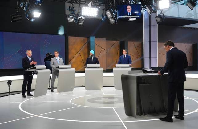 April 16, 2025, Montreal, Pq, Canada: Moderator, Radio-CanadaöÄÃ s Patrice Roy, Bloc Quebecois Leader Yves-Francois Blanchet, New Democratic Party Leader Jagmeet Singh and Conservative Leader Pierre Poilievre listen as Liberal Leader Mark Carney speaks during the French-language federal leaders debate, in Montreal, Wednesday, April 16, 2025. Montreal Canada - ZUMAc35_ 20250416_zaf_c35_142 Copyright: xSeanxKilpatrickx