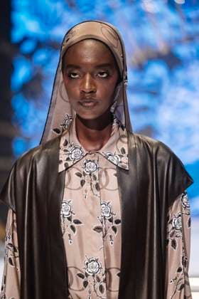 April 15, 2025, Abu Dhabi, United Arab Emirates: A model with floral motives seen taking the runway for Imannoor. Turkish brand Imannor presented at the final show of the second day of Abu Dhabi Modest Fashion Week 2025 (14-16 April), organized by Think Fashion at St. Regis Saadiyat Island Resort. Abu Dhabi United Arab Emirates - ZUMAs197 20250415_aaa_s197_614 Copyright: xValeriaxFerrarox