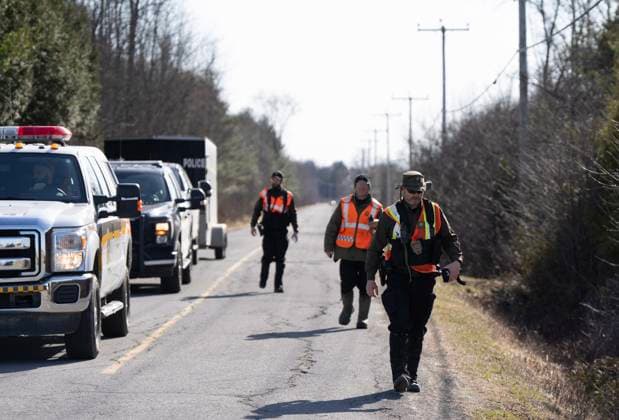 April 17, 2025, Godmanchester, Pq, CANADA: Surete du Quebec and RCMP officers arrive back at a command post after searching for a woman and her two children who are missing crossing the border into Canada illegally overnight in Godmanchester, Que., Thursday, April 17, 2025. Godmanchester CANADA  - ZUMAc35_ 20250417_zaf_c35_057 Copyright: xChristinnexMuschix