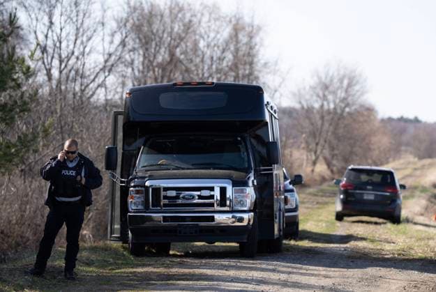 April 17, 2025, Godmanchester, Pq, CANADA: Surete du Quebec and RCMP officers set up a command post to search for a woman and her two children who are missing crossing the border into Canada illegally overnight in Godmanchester, Que., on Thursday, April 17, 2025. Godmanchester CANADA  - ZUMAc35_ 20250417_zaf_c35_068 Copyright: xChristinnexMuschix