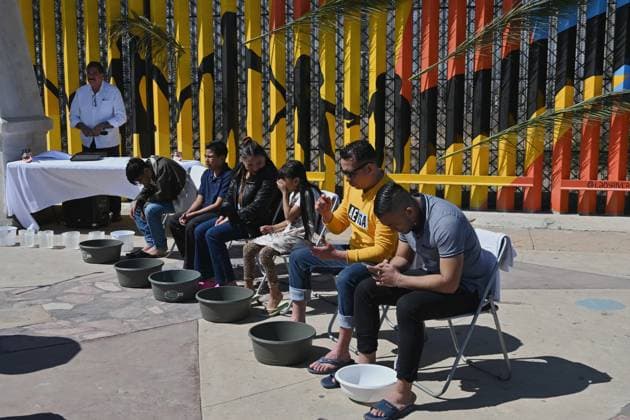April 17, 2025, Tijuana, Baja California, Mexico: Migrants from La Casa del Migrante in Tijuana, Mexico wait to get their feel washed during the annual foot washing ceremony where volunteers wash and clean the feet of migrants during a ceremony for holy week in accordance to the twelve apostles remembrance of Jesus Christ Ã¢â‚¬oeFor I have given you an example, that you should do as I have done to youÃ¢â‚¬Â as Father Pat Murphy compares Jesus act to migrants plight and the unfair treatment of migrants and urged for a time of reflection for those seeking the right to freedom of movement and humanitarian asylum on Thursday, April 17, 2025 at TijuanaÃ¢â‚¬â ¢s Friendship Park circle on the US-Mexico border. Tijuana Mexico - ZUMAm180 20250417_zip_m180_005 Copyright: xCarlosxA.xMorenox