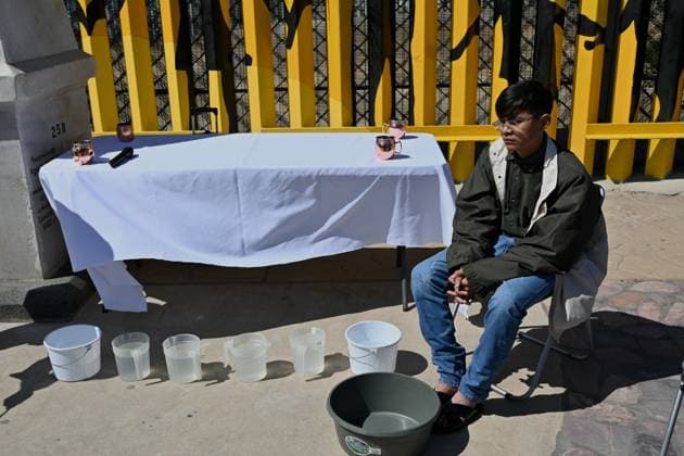 April 17, 2025, Tijuana, Baja California, Mexico: A young migrant waits to get his feet washed during the annual foot washing ceremony where volunteers from The Migrant Defense Coalition wash and clean the feet of migrants during a ceremony for holy week in accordance to the twelve apostles remembrance of Jesus Christ Ã¢â‚¬oeFor I have given you an example, that you should do as I have done to youÃ¢â‚¬Â as Father Pat Murphy compares Jesus act to migrants plight and the unfair treatment of migrants and urged for a time of reflection for those seeking the right to freedom of movement and humanitarian asylum on Thursday, April 17, 2025 at TijuanaÃ¢â‚¬â ¢s Friendship Park circle on the US-Mexico border. Tijuana Mexico - ZUMAm180 20250417_zip_m180_001 Copyright: xCarlosxA.xMorenox