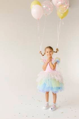 Creative Highlights Symbolfotos Girl in colorful tutu holding balloons and smiling indoors model released, Symbolfoto property released, VIVF01636