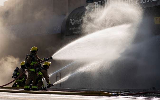 April 23, 2025, Vancouver, Bc, CANADA: Vancouver firefighters battle a flare up while fighting a three alarm fire on East Hastings Street in Vancouver, on Wednesday April 23, 2025. Vancouver CANADA  - ZUMAc35_ 20250423_zaf_c35_032 Copyright: xRichxLamx