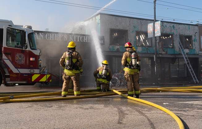 April 23, 2025, Vancouver, Bc, CANADA: Vancouver firefighters pour water on hot spots while battling a three alarm fire on East Hastings Street in Vancouver, on Wednesday April 23, 2025. Vancouver CANADA  - ZUMAc35_ 20250423_zaf_c35_034 Copyright: xRichxLamx