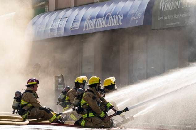 April 23, 2025, Vancouver, Bc, CANADA: Vancouver firefighters pour water on a flare up while fighting a three alarm fire on East Hastings Street in Vancouver, on Wednesday April 23, 2025. Vancouver CANADA  - ZUMAc35_ 20250423_zaf_c35_036 Copyright: xRichxLamx