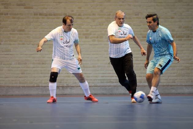 April 25, 2025, Tehran, Iran: Iranian President MASOUD PEZESHKIAN (C) participates in a football match to celebrate Iran Labor Week and honor the laborers of the nation, competing between the workers and veterans teams. Tehran Iran - ZUMAi98_ 20250425_zih_i98_005 Copyright: xIranianxPresidencyx