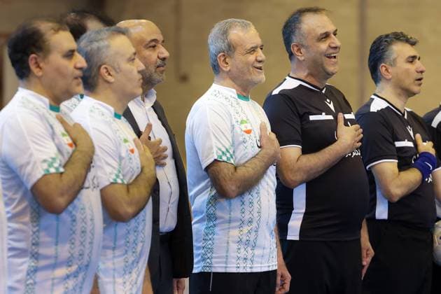 April 25, 2025, Tehran, Iran: Iranian President MASOUD PEZESHKIAN (C) participates in a football match to celebrate Iran Labor Week and honor the laborers of the nation, competing between the workers and veterans teams. Tehran Iran - ZUMAi98_ 20250425_zih_i98_008 Copyright: xIranianxPresidencyx