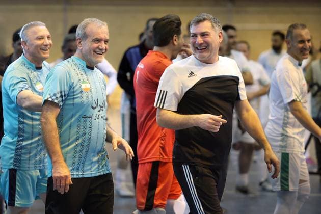 April 25, 2025, Tehran, Iran: Iranian President MASOUD PEZESHKIAN (2L) participates in a football match to celebrate Iran Labor Week and honor the laborers of the nation, competing between the workers and veterans teams. Tehran Iran - ZUMAi98_ 20250425_zih_i98_013 Copyright: xIranianxPresidencyx