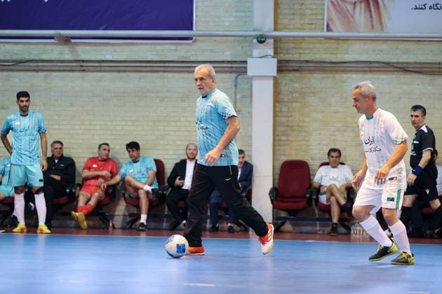 April 25, 2025, Tehran, Iran: Iranian President MASOUD PEZESHKIAN (C) participates in a football match to celebrate Iran Labor Week and honor the laborers of the nation, competing between the workers and veterans teams. Tehran Iran - ZUMAi98_ 20250425_zih_i98_016 Copyright: xIranianxPresidencyx
