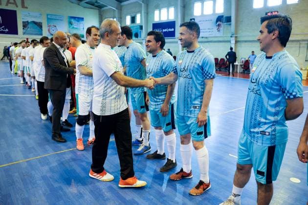 April 25, 2025, Tehran, Iran: Iranian President MASOUD PEZESHKIAN (C) participates in a football match to celebrate Iran Labor Week and honor the laborers of the nation, competing between the workers and veterans teams. Tehran Iran - ZUMAi98_ 20250425_zih_i98_023 Copyright: xIranianxPresidencyx