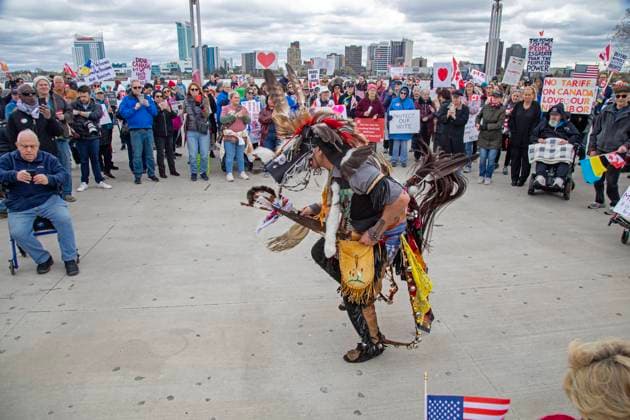 April 26, 2025, Detroit, Michigan, USA: Detroit, Michigan USA - 26 April 2025 - A Bridging Our Friendship rally on the banks of the Detroit River pushes back at the anti-Canada attitude of the Trump Administration. Michael Hatch of the Sault Ste Marie Tribe of Chippewa Indians danced for the crowd. A similar rally took place acress the river in Windsor, Ontario, and at other border crossings in Michigan and Ontario. Detroit USA - ZUMAw66_ 20250426_zaf_w66_020 Copyright: xJimxWestx