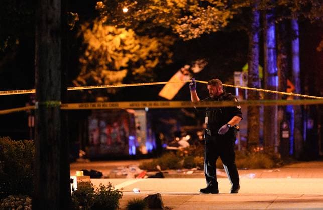 (250427) -- VANCOUVER, April 27, 2025 -- A policeman works at the site of a car striking incident in Vancouver, Canada, April 27, 2025. Nine people have been confirmed dead after a driver drove into a crowd at a street festival in Vancouver, Canada, on Saturday evening, local police said on Sunday. (Photo by Xinhua) PhotoFlash 9 people killed in Vancouver street festival as car driven into crowd LiangxSen 