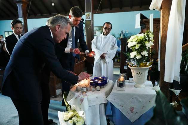 April 27, 2025, Vancouver, Bc, Canada: Liberal Leader Mark Carney, B.C. Premier David Eby and Vancouver Mayor Ken Sim light candles as they visit St. Mary the Vigil South Hill Church as Fr. Expedito Farinas looks on in Vancouver, B.C., on Sunday, April 27, 2025. Shock and grief rippled through Canada s Filipino community on Sunday as members struggled to come to grips with an attack at a cultural street festival in Vancouver on Saturday that killed 11 people and injured dozens more. Vancouver Canada  - ZUMAc35_ 20250427_zaf_c35_112 Copyright: xSeanxKilpatrickx