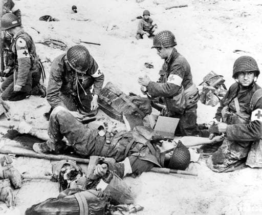 June 6, 1944, Normandy, France: American medics rendering first aid to troops in initial landing on Utah Beach, Les Dunes de Madeleine, Normandy, France, U.S. Army Signal Corps, June 6, 1944 France - ZUMAg145 19440606_aza_g145_009 Copyright: xJTxVintagex