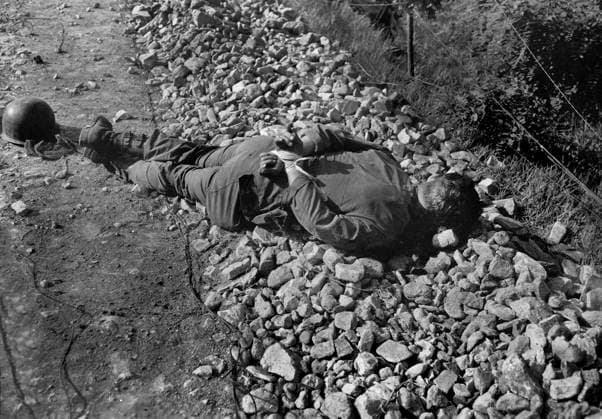 July 10, 1950, South Korea: One of four Americans of U.S. 21st Infantry Regiment, captured night of July 9th, and shot thru head with hands tied behind their backs, found between forward observation post and the front line, South Korea, U.S. Army Signal Corps, July 10, 1950 South Korea - ZUMAg145 19500710_aza_g145_001 Copyright: xJTxVintagex