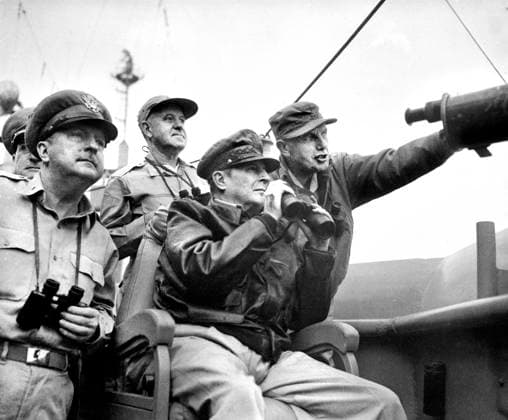September 15, 1950, Incheon, South Korea: U.S. Brigadier General Courtney Whitney; U.S. General Douglas MacArthur, Commander in Chief of U.N. Forces; and U.S. Major General Edward Almond, observing the shelling of Inchon from U.S.S. Mt. McKinley, U.S. Army Signal Corps, September 15, 1950 Incheon South Korea - ZUMAg145 19500915_aza_g145_001 Copyright: xJTxVintagex