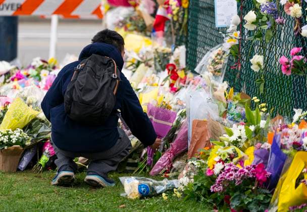 April 28, 2025, Vancouver, Bc, CANADA: A member of the public leaves flowers a memorial site close to the location where a car drove through a crowd killing multiple people Saturday night in Vancouver, Monday April 28, 2025. Vancouver CANADA  - ZUMAc35_ 20250428_zaf_c35_057 Copyright: xRichxLamx