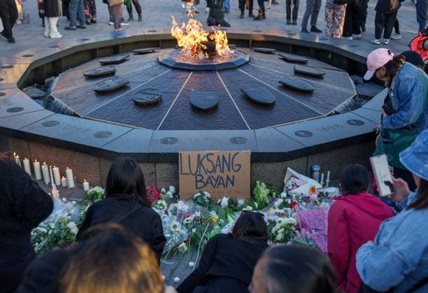 April 28, 2025, Ottawa, On, Canada: People leave flowers and light candles during a vigil for the victims of an attack that killed 11 people at a Vancouver Filipino heritage festival on Saturday, in Ottawa, on Monday, April 28, 2025. Ottawa Canada  - ZUMAc35_ 20250428_zaf_c35_081 Copyright: xChrisxTanouyex