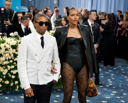 Pharrell Williams and Helen Lasichanh arrive on the red carpet at the 2025 Met Gala celebrating the opening of Superfine: Tailoring Black Style at The Metropolitan Museum of Art on Monday, May 5, 2025 in New York City.  NYP20250505109 JOHNxANGELILLO