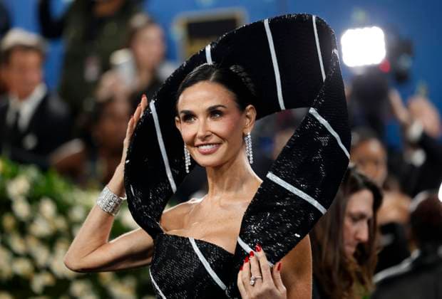 Demi Moore arrives on the red carpet at the 2025 Met Gala celebrating the opening of Superfine: Tailoring Black Style at The Metropolitan Museum of Art on Monday, May 5, 2025 in New York City.  NYP20250505124 JOHNxANGELILLO