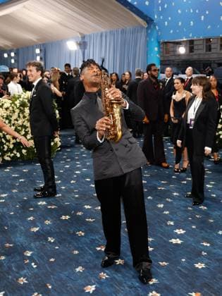 Jon Batiste arrives on the red carpet at the 2025 Met Gala celebrating the opening of Superfine: Tailoring Black Style at The Metropolitan Museum of Art on Monday, May 5, 2025 in New York City.  NYP20250505586 JOHNxANGELILLO