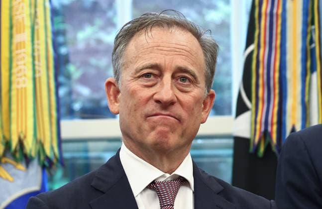 May 5, 2025, Washington, District Of Columbia, USA: Josh Harris, Managing Partner, Washington Commanders listens as US President Donald J Trump announces that DC will host the 2027 NFL draft in the Oval Office of the White House in Washington, DC USA, 05 May 2025. The move comes after the Washington Commanders announced they planned to return to DC in a new stadium built on the site of Robert F Kennedy Stadium Washington USA - ZUMAs152 20250505_faa_s152_003 Copyright: xJimxLoScalzox-xPoolxviaxCNPx