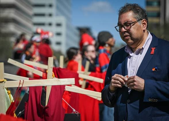 Edmonton Marks Red Dress Day To Honour Missing And Murdered Indigenous Women And Girls EDMONTON, CANADA MAY 5: Naheed Nenshi, leader of the Alberta New Democratic Party, pauses for a moment of reflection as he walks through a symbolic memorial of wooden crosses and red dresses, honouring missing and murdered Indigenous women and girls (MMIWG), outside the Alberta Legislature in Edmonton on May 5, 2025. Red Dress Day is an annual event initiated by the REDress Project to honour the lives of MMIWG across Canada, first observed on May 5, 2010. Edmonton Canada  Copyright: xArturxWidakx originalFilename: widak-edmonton250505_np8bk.jpg