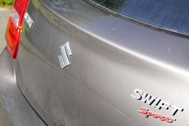 Suzuki Swift sport, Car brand symbol on Heck one Car 1131602749