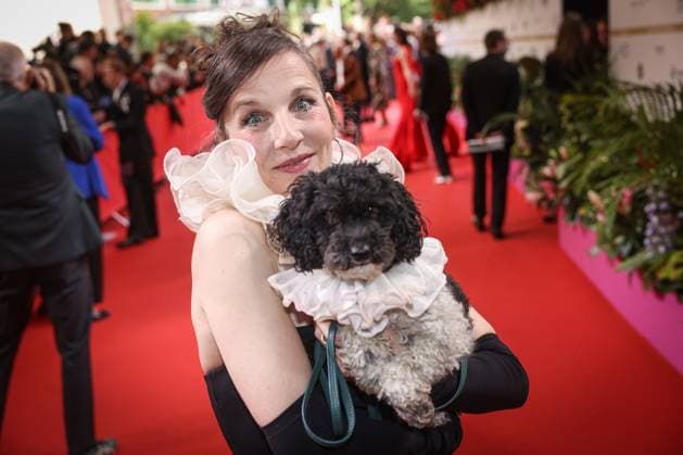 GERMAN FILM AWARD 2025 ceremony in Berlin Meret Becker with dog on the red carpet at the Lola German Film Award 2025 ceremony at the Theater am Potsdamer Platz in Berlin Date 10 05 2025 Copyright: xEventpressx