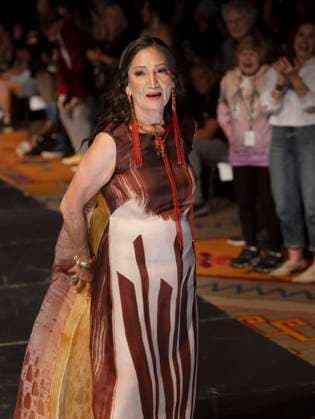 May 11, 2025 - Santa Fe, New Mexico, USA - Former Secretary of the Interior and current candidate for governor of New Mexico, DEB HAALAND, walks the runway in a dress by legendary designer Patricia Michaels during the Second Annual Southwestern Association for Indian Arts (SWAIA) Native Fashion Week. An offshoot of the Santa Fe Indian Market, Fashion Week highlights indigenous design, creativity and representation in the fashion industry. Santa Fe USA - ZUMAce6_ 20250511_zaf_ce6_002 Copyright: xBrianxCahnx