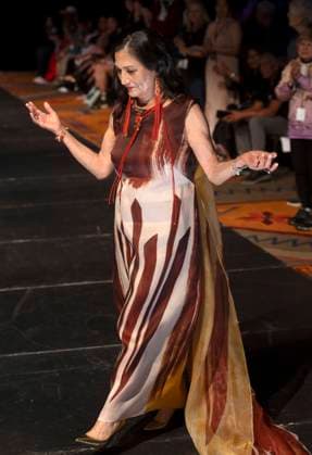 May 11, 2025 - Santa Fe, New Mexico, USA - Former Secretary of the Interior and current candidate for governor of New Mexico, DEB HAALAND, walks the runway in a dress by legendary designer Patricia Michaels during the Second Annual Southwestern Association for Indian Arts (SWAIA) Native Fashion Week. An offshoot of the Santa Fe Indian Market, Fashion Week highlights indigenous design, creativity and representation in the fashion industry. Santa Fe USA - ZUMAce6_ 20250511_zaf_ce6_003 Copyright: xBrianxCahnx