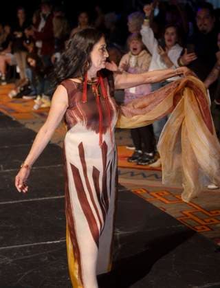 May 11, 2025 - Santa Fe, New Mexico, USA - Former Secretary of the Interior and current candidate for governor of New Mexico, DEB HAALAND, walks the runway in a dress by legendary designer Patricia Michaels during the Second Annual Southwestern Association for Indian Arts (SWAIA) Native Fashion Week. An offshoot of the Santa Fe Indian Market, Fashion Week highlights indigenous design, creativity and representation in the fashion industry. Santa Fe USA - ZUMAce6_ 20250511_zaf_ce6_004 Copyright: xBrianxCahnx