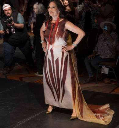 May 11, 2025 - Santa Fe, New Mexico, USA - Former Secretary of the Interior and current candidate for governor of New Mexico, DEB HAALAND, walks the runway in a dress by legendary designer Patricia Michaels during the Second Annual Southwestern Association for Indian Arts (SWAIA) Native Fashion Week. An offshoot of the Santa Fe Indian Market, Fashion Week highlights indigenous design, creativity and representation in the fashion industry. Santa Fe USA - ZUMAce6_ 20250511_zaf_ce6_006 Copyright: xBrianxCahnx