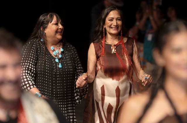 May 11, 2025 - Santa Fe, New Mexico, USA - With famed designer PATRICIA MICHAELS (left), former Secretary of the Interior and current candidate for governor of New Mexico, DEB HAALAND, gathers with other PM Waterlilly models after walking the runway during the Second Annual Southwestern Association for Indian Arts (SWAIA) Native Fashion Week. An offshoot of the Santa Fe Indian Market, Fashion Week highlights indigenous design, creativity and representation in the fashion industry. Santa Fe USA - ZUMAce6_ 20250511_zaf_ce6_007 Copyright: xBrianxCahnx