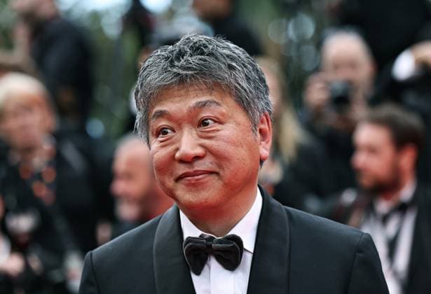 (250514) -- CANNES, May 14, 2025 -- Japanese director Kore-eda Hirokazu arrives on the red carpet for the opening ceremony of the 78th edition of the Cannes Film Festival in Cannes, France, May 13, 2025. ) FRANCE-CANNES-FILM FESTIVAL-OPENING GaoxJing 