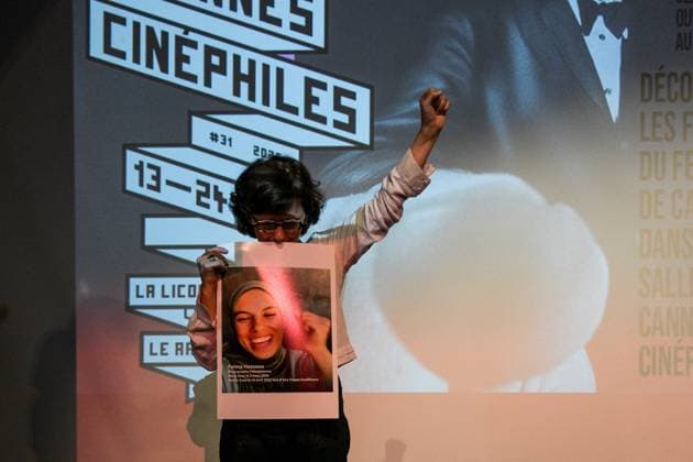 Cannes - Screening Put Your Soul on Your Hand and Walk French Iranian Sepideh Farsi reacts with a photo of killed Palestinian photographer Fatma Hassona, killed in an Israeli attack on her house, at the end of the screening of her movie ‘Put Your Soul on Your Hand and Walk’, as part of ACID competition, at the 78th annual Cannes Film Festival, in Cannes, France, on May 15, 2025. Photo by Ammar Abd Rabbo ABACAPRESS.COM Cannes France  Copyright: xAbdxRabboxAmmar ABACAx