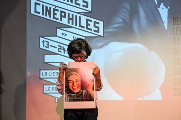 Cannes - Screening Put Your Soul on Your Hand and Walk French Iranian Sepideh Farsi reacts with a photo of killed Palestinian photographer Fatma Hassona, killed in an Israeli attack on her house, at the end of the screening of her movie ‘Put Your Soul on Your Hand and Walk’, as part of ACID competition, at the 78th annual Cannes Film Festival, in Cannes, France, on May 15, 2025. Photo by Ammar Abd Rabbo ABACAPRESS.COM Cannes France  Copyright: xAbdxRabboxAmmar ABACAx