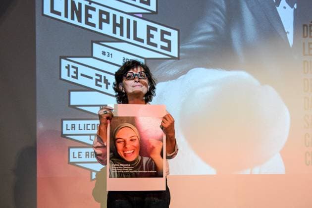 Cannes - Screening Put Your Soul on Your Hand and Walk French Iranian Sepideh Farsi reacts with a photo of killed Palestinian photographer Fatma Hassona, killed in an Israeli attack on her house, at the end of the screening of her movie ‘Put Your Soul on Your Hand and Walk’, as part of ACID competition, at the 78th annual Cannes Film Festival, in Cannes, France, on May 15, 2025. Photo by Ammar Abd Rabbo ABACAPRESS.COM Cannes France  Copyright: xAbdxRabboxAmmar ABACAx