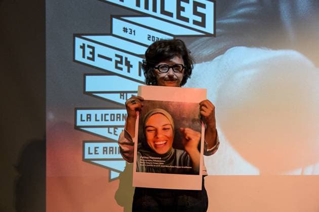 Cannes - Screening Put Your Soul on Your Hand and Walk French Iranian Sepideh Farsi reacts with a photo of killed Palestinian photographer Fatma Hassona, killed in an Israeli attack on her house, at the end of the screening of her movie ‘Put Your Soul on Your Hand and Walk’, as part of ACID competition, at the 78th annual Cannes Film Festival, in Cannes, France, on May 15, 2025. Photo by Ammar Abd Rabbo ABACAPRESS.COM Cannes France  Copyright: xAbdxRabboxAmmar ABACAx