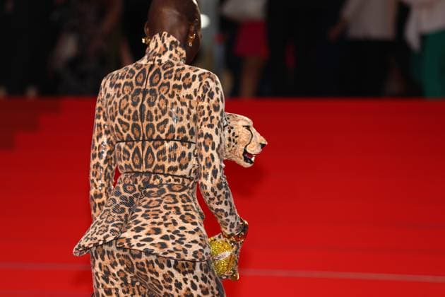 May 15, 2025, Cannes, Cote D azur, France: A guest wears a leopard print and leopard head dress on the red carpet for the Sirat Premiere screening at the 78th Annual Cannes Film Festival at Palais des Festivals in Cannes, France Cannes France - ZUMAc179 20250515_zep_c179_245 Copyright: xMickaelxChavetx