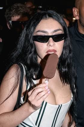 Cannes, Celebrity Sightings During Cannes Film Festival 78, Charli XCX Eats Ice Cream While Walking Down The Croisette On Her Way To The Magnum Party Cannes, Celebrity Sightings During Cannes Film Festival 78, Charli XCX Eats Ice Cream While Walking Down The Croisette On Her Way To Party Magnum. In The Photo: Charli XCX (British Singer) Milan Italy  Copyright: xIPA ABACAx