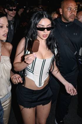 Cannes, Celebrity Sightings During Cannes Film Festival 78, Charli XCX Eats Ice Cream While Walking Down The Croisette On Her Way To The Magnum Party Cannes, Celebrity Sightings During Cannes Film Festival 78, Charli XCX Eats Ice Cream While Walking Down The Croisette On Her Way To Party Magnum. In The Photo: Charli XCX (British Singer) Milan Italy  Copyright: xIPA ABACAx