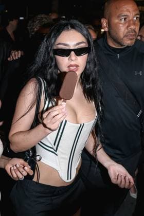 Cannes, Celebrity Sightings During Cannes Film Festival 78, Charli XCX Eats Ice Cream While Walking Down The Croisette On Her Way To The Magnum Party Cannes, Celebrity Sightings During Cannes Film Festival 78, Charli XCX Eats Ice Cream While Walking Down The Croisette On Her Way To Party Magnum. In The Photo: Charli XCX (British Singer) Milan Italy  Copyright: xIPA ABACAx