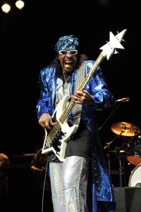 Bootsy Collins live at the indigo2 Bootsy Collins - (William Earl Bootsy Collins) Performing live at the indigo2, London, England. July 11th, 2011 stage concert live gig performance music half 3 4 length silver sparkly shiny trousers blue jacket mouth open bandana black sunglasses shades bass guitar CAP MAR Martin Harris London Great Britain Copyright: xMartinxHarris CapitalxPicturesx
