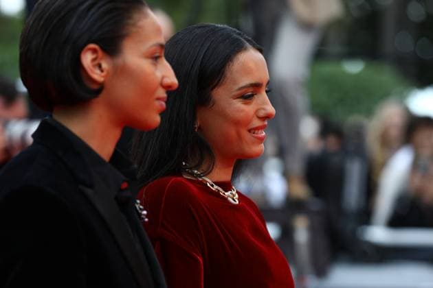 May 16, 2025, Cannes, Cote D azur, France: Director HAFSIA HERZI hugs actress NADIA MELLITI on the red carpet for the La Petite Derniere Premiere screening at the 78th Annual Cannes Film Festival at Palais des Festivals in Cannes, France Cannes France - ZUMAc179 20250516_zep_c179_194 Copyright: xMickaelxChavetx