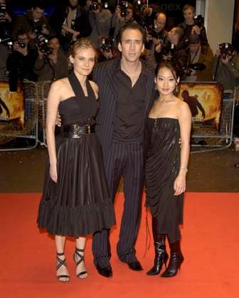 National Treasure premiere DIANE KRUGER, NICOLAS CAGE & ALICE KIM National Treasure premiere Odeon West End Cinema London 5 December 2004. full length black dress belt belted strappy shoes nicholas Ref: PL London Great Britain Copyright: xPhilxLoftus CapitalxPicturesx
