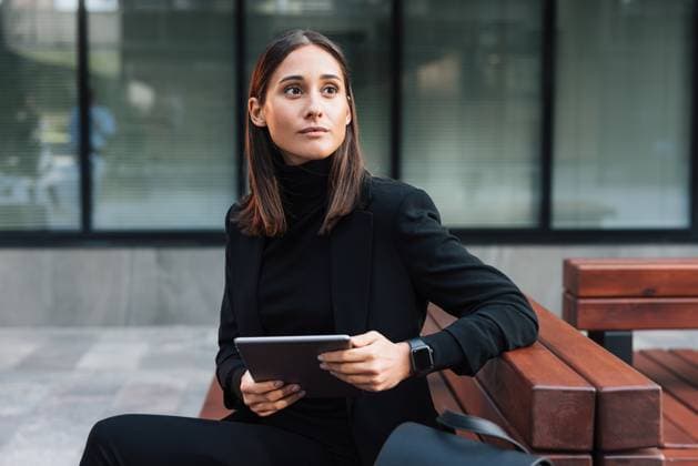 Creative Highlight Symbolbilder Serious and stylish woman sitting outdoors with a digital tablet and looking away Serious and stylish woman sitting outdoors with a digital tablet and looking away Russia Copyright: xArtemxVarnitsinxArtemxVarnitsinx