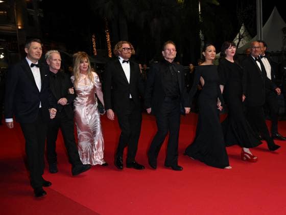 Cannes, 78th Cannes Film Festival 2025 - Evening 4 - Red Carpet of the Film Bono: Stories of Surrender Cannes, 78th Cannes Film Festival 2025 - Evening 4 - Red Carpet of the Film Bono: Stories of Surrender . In the Photo Erik Messerschmidt, Bono, Kelly McNamara and Jon Kamen Cannes France  Copyright: xIPA ABACAx