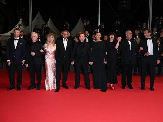 Cannes, 78th Cannes Film Festival 2025 - Evening 4 - Red Carpet of the Film Bono: Stories of Surrender Cannes, 78th Cannes Film Festival 2025 - Evening 4 - Red Carpet of the Film Bono: Stories of Surrender . In the Photo Erik Messerschmidt, Bono, Kelly McNamara and Jon Kamen Cannes France  Copyright: xIPA ABACAx